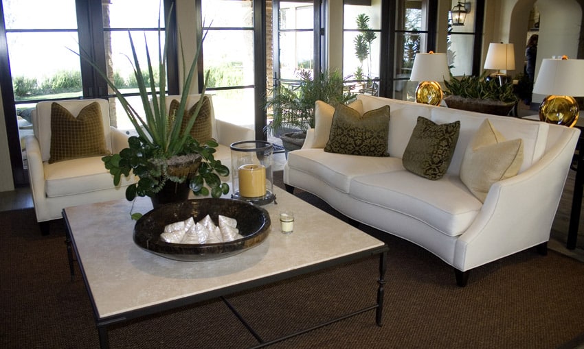 White couches in living room with white coffee table