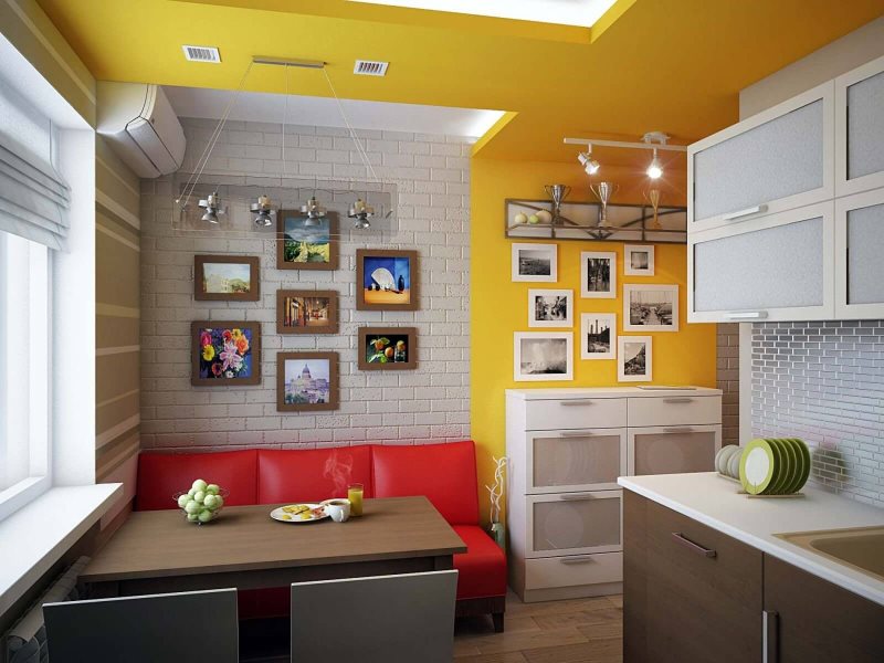 Прямой узкий диван с красной обивкой на кухне с желтой стеной