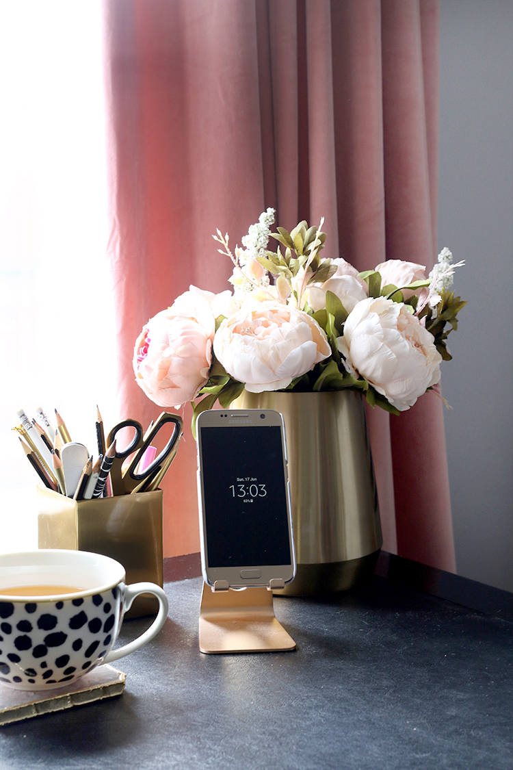 office desk detail with pink peonies, gold accessories and blush pink curtains